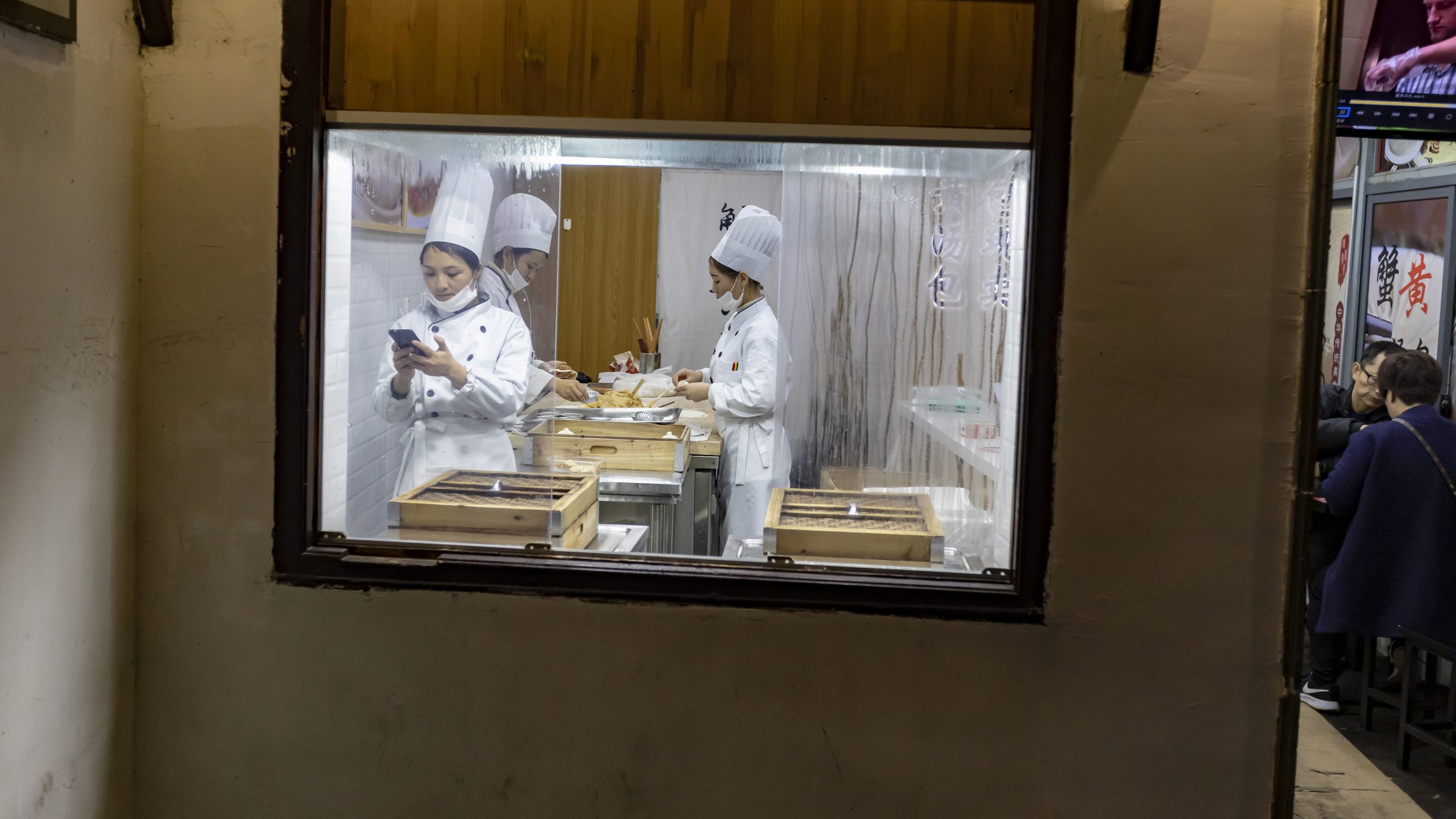 Bakery workers in Suzhou, China - travel photography China - photo by photographer Tuomas Harjumaaskola, China