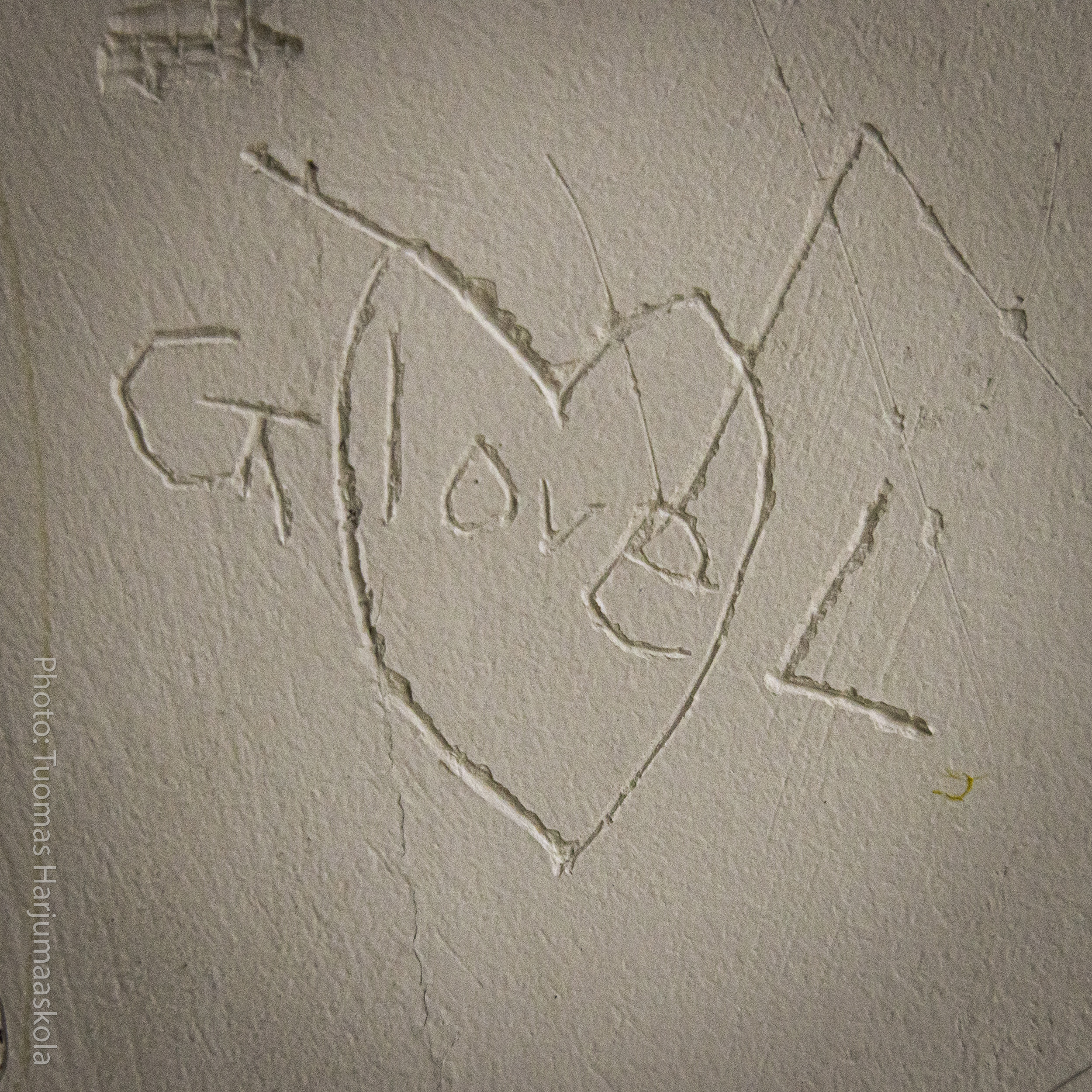 A confession of love scratched on the wall. “G love L.” Photographer by Tuomas Harjumaaskola.